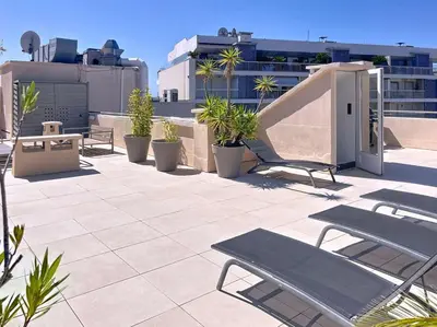 a patio with chairs and plants on a building at Fantastic penthouse 3 bedroom Croisette 406 in Cannes