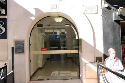 a man standing in front of a building at Fantastic penthouse 3 bedroom Croisette 406 in Cannes