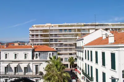 a group of buildings in front of a large building at Lecerf 2P CUR1095 in Cannes