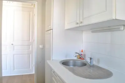 a kitchen with a sink and a white cabinet at Lecerf 2P CUR1095 in Cannes