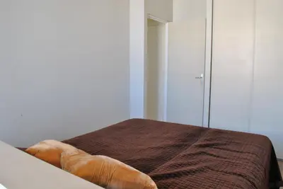 a bedroom with a bed and a mirror at Lecerf 2P CUR1095 in Cannes