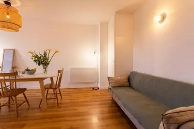 a living room with a couch and a table at Marechal Foch / GOLD2025 / ST in Cannes
