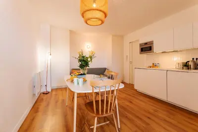 a kitchen and dining room with a table and chairs at Marechal Foch / GOLD2025 / ST in Cannes