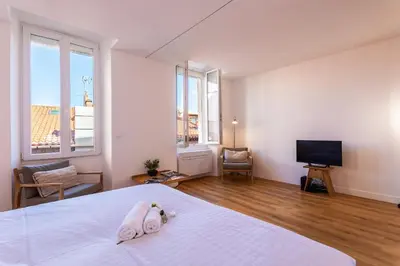 a bedroom with a bed with a stuffed animal on it at Marechal Foch / GOLD2025 / ST in Cannes