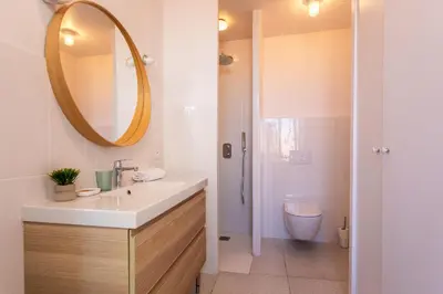 a bathroom with a sink and a mirror at Marechal Foch / GOLD2025 / ST in Cannes