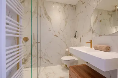 a bathroom with a sink and a toilet and a shower at La Guitare 21 - Cozy studio in center of Cannes, just behind Grand Hotel in Cannes