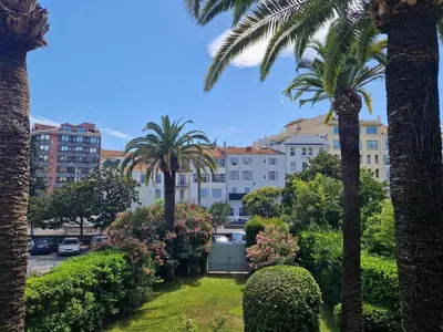 a view of a city with palm trees and buildings at Cannes près Croisette beau 2 pièces 3 étoiles in Cannes