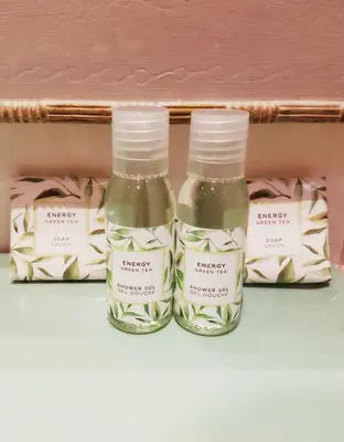 two bottles of essential oils sitting on a shelf at Azurene Royal Hotel in Cannes
