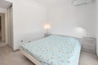 a bedroom with a bed and a window at Stunning 3-Br Apartment with Large Terrace and Pool in Cannes