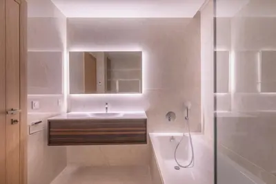 a white bathroom with a sink and a shower at Agence AICI - Appartements Gray d'Albion in Cannes