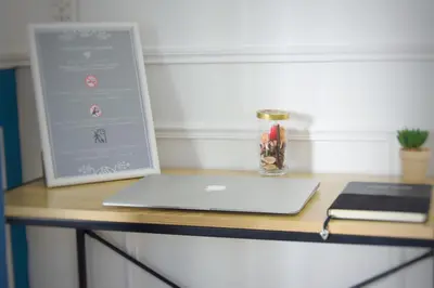 a desk with a laptop computer on top of it at - Luxury Appart Climatisé Plage - in Cannes