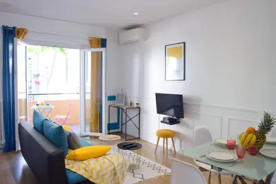 a living room with a couch and a table at - Luxury Appart Climatisé Plage - in Cannes