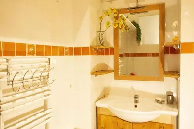 a bathroom with a sink and a mirror at CANNES - À DEUX PAS DU PALAIS DES FESTIVALS in Cannes