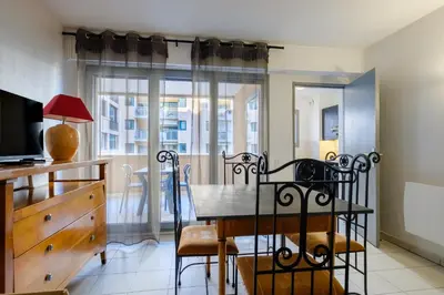 a dining room with a table and chairs at Residhotel Villa Maupassant in Cannes