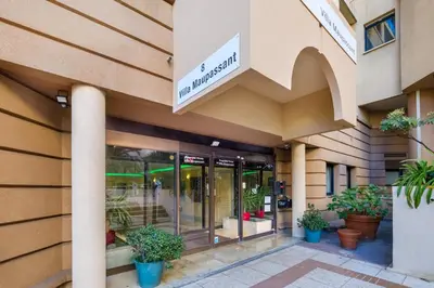 a store front of a building with potted plants at Residhotel Villa Maupassant in Cannes