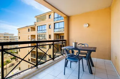 a balcony with a table and chairs on it at Residhotel Villa Maupassant in Cannes