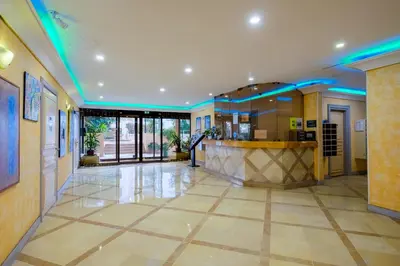 a lobby with a bar in a building at Residhotel Villa Maupassant in Cannes
