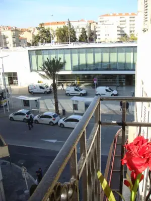 a view of a parking lot with cars parked in front of a building at Little Palace in Cannes