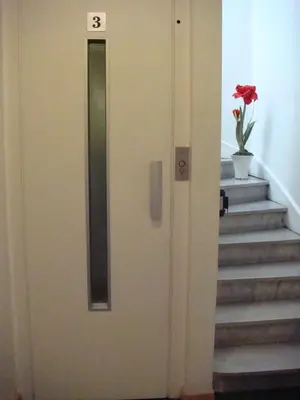 a door with a number on it next to some stairs at Little Palace in Cannes