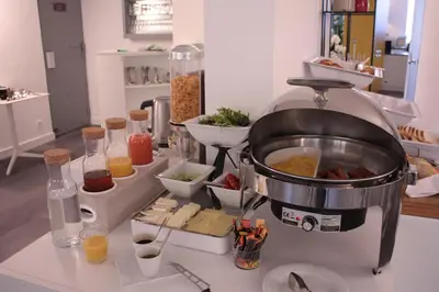 a mixer sitting on a counter with some food at Hotel Abrial by Soniho in Cannes