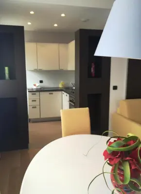a white table in a kitchen with a white counter top at Arthur Properties Bel Air in Cannes
