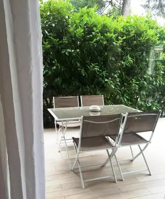 a table and chairs sitting on a patio at Arthur Properties Bel Air in Cannes