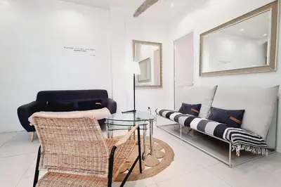 a living room with a glass table and a couch at Old harbor 3-bedroom apt charming & unique ! in Cannes