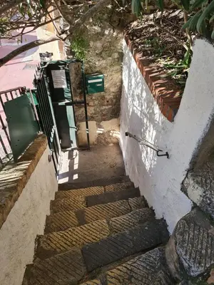 a set of stairs leading up to a building at Old harbor 3-bedroom apt charming & unique ! in Cannes