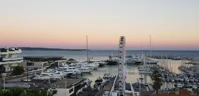 a marina with many boats in the water at O Festival Palace, terrace with panoramic sea view in Cannes