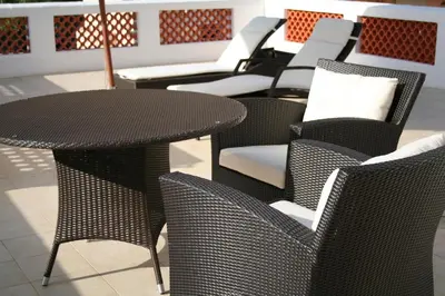 a row of chairs and a table and chairs at Hotel Alexandre III in Cannes
