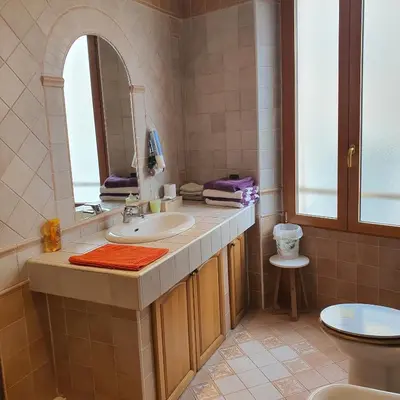 a bathroom with a sink and a mirror at CLEM SOLEIL in Cannes