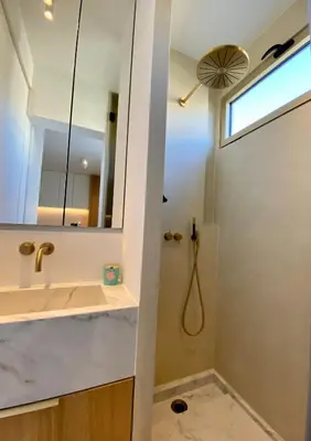 a bathroom with a shower and a sink and a mirror at Blvd De La Croisette 82A, Cannes, La Réale in Cannes