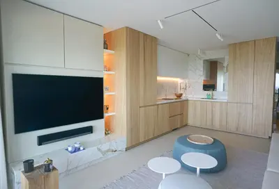 a living room with a tv and two tables and a couch at Blvd De La Croisette 82A, Cannes, La Réale in Cannes