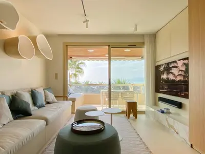 a living room with a couch and a table at Blvd De La Croisette 82A, Cannes, La Réale in Cannes