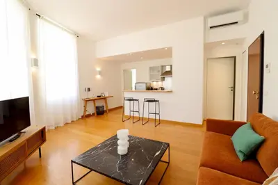 a living room with a couch and a table at Residence Buttura in Cannes