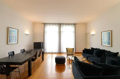 a living room with a couch and a table at Residence Buttura in Cannes