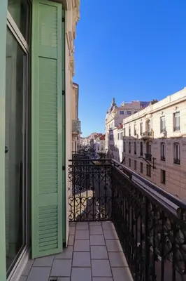 a room with a green door on a balcony at Residence Buttura in Cannes