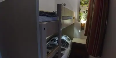 a room with a closet with two bunk beds at Studio cabine vue mer, piscine panoramique, parking couvert in Cannes