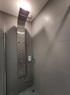 a bathroom with a shower with a glass door at Très beau T2 dans parc montfleury ,proche centre ,au calme 44 bd Montfleury in Cannes