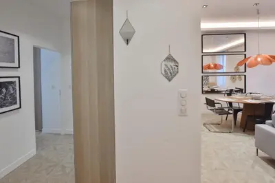 a living room with a couch and a table at Modern 3-Br Apartment in City Center 5 Minutes from Palais and Beache in Cannes