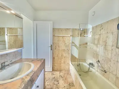 a bathroom with a tub and a sink and a shower at Vezelay, by Welcome to Cannes in Cannes