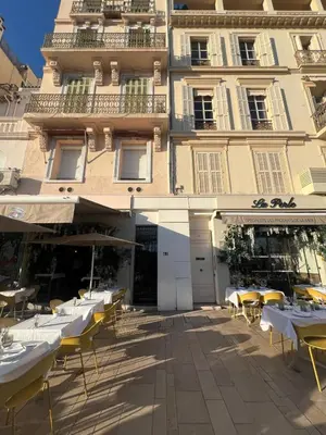 a group of tables and chairs in front of a building at Spacieux 2 Pièces Vue MER, FELIX FAURE- FORVILLE A1B047 in Cannes