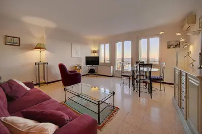 a living room with a purple couch and a table at Spacieux 2 Pièces Vue MER, FELIX FAURE- FORVILLE A1B047 in Cannes