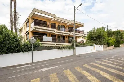 a building on the side of a street at Vivre Cannes l Parking l Balcony l 15min to La Croisette in Cannes