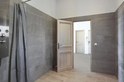 a bathroom with a shower and a glass door at Appartement Carnot - Welkeys in Cannes
