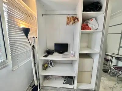 a room with a desk and a computer on a shelf at Minerve by Welcome to Cannes in Cannes