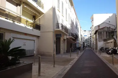 an empty street in a city with buildings at Minerve by Welcome to Cannes in Cannes