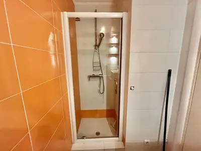 a shower with a glass door in a bathroom at Minerve by Welcome to Cannes in Cannes