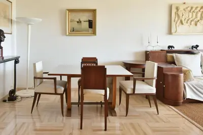 a dining room with a table and chairs at Close to downtown Cannes swimming pool and sea view in Cannes