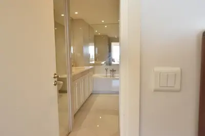 a bathroom with a tub and a sink and a mirror at Close to downtown Cannes swimming pool and sea view in Cannes